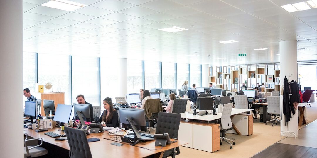 Office team working on computers supported by an AMC IT service plan